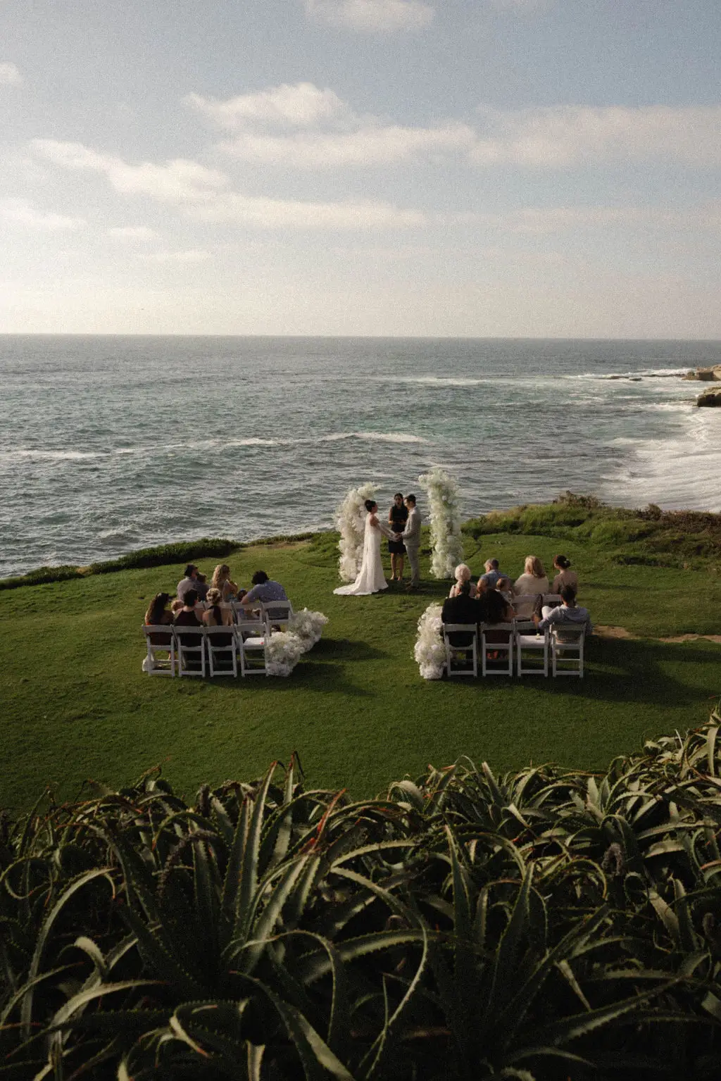 Oceanfront Cuvier Park Wedding Bowl ceremony and La Valencia wedding portraits in La Jolla by Cinematica Weddings.