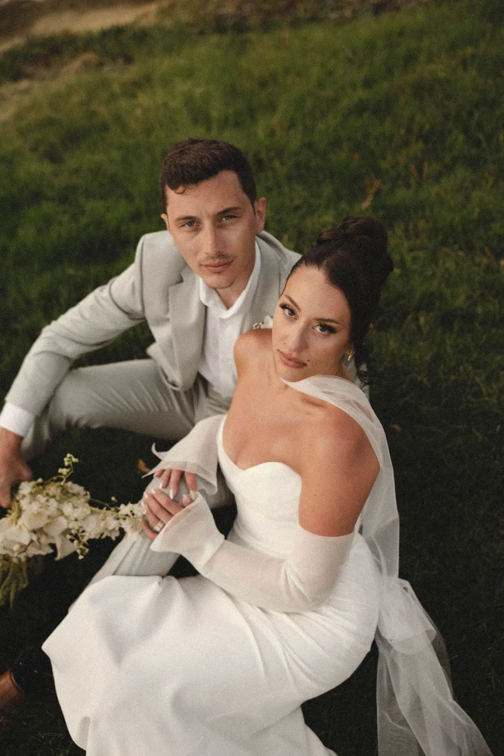 Amber and Tom take portraits along the La Jolla coastline after their Wedding Bowl ceremony.